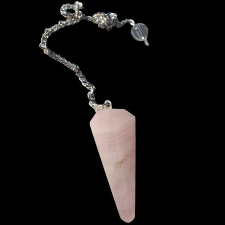 Rose Quartz faceted cone dowsing pendulum 34mm 9g in sunlight - Rocks and Things Store
