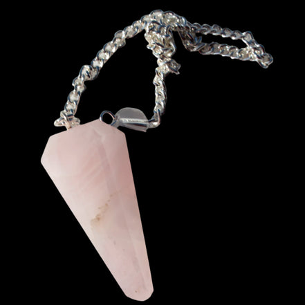 Rose Quartz faceted cone dowsing pendulum 34mm 9g in sunlight - Rocks and Things Store