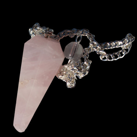 Rose Quartz faceted cone dowsing pendulum 34mm 9g in sunlight - Rocks and Things Store