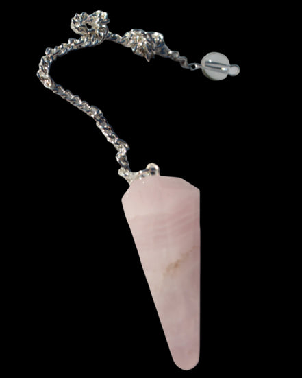 Rose Quartz faceted cone dowsing pendulum 34mm 9g in sunlight - Rocks and Things Store