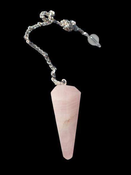 Rose Quartz faceted cone dowsing pendulum 34mm 9g in sunlight - Rocks and Things Store
