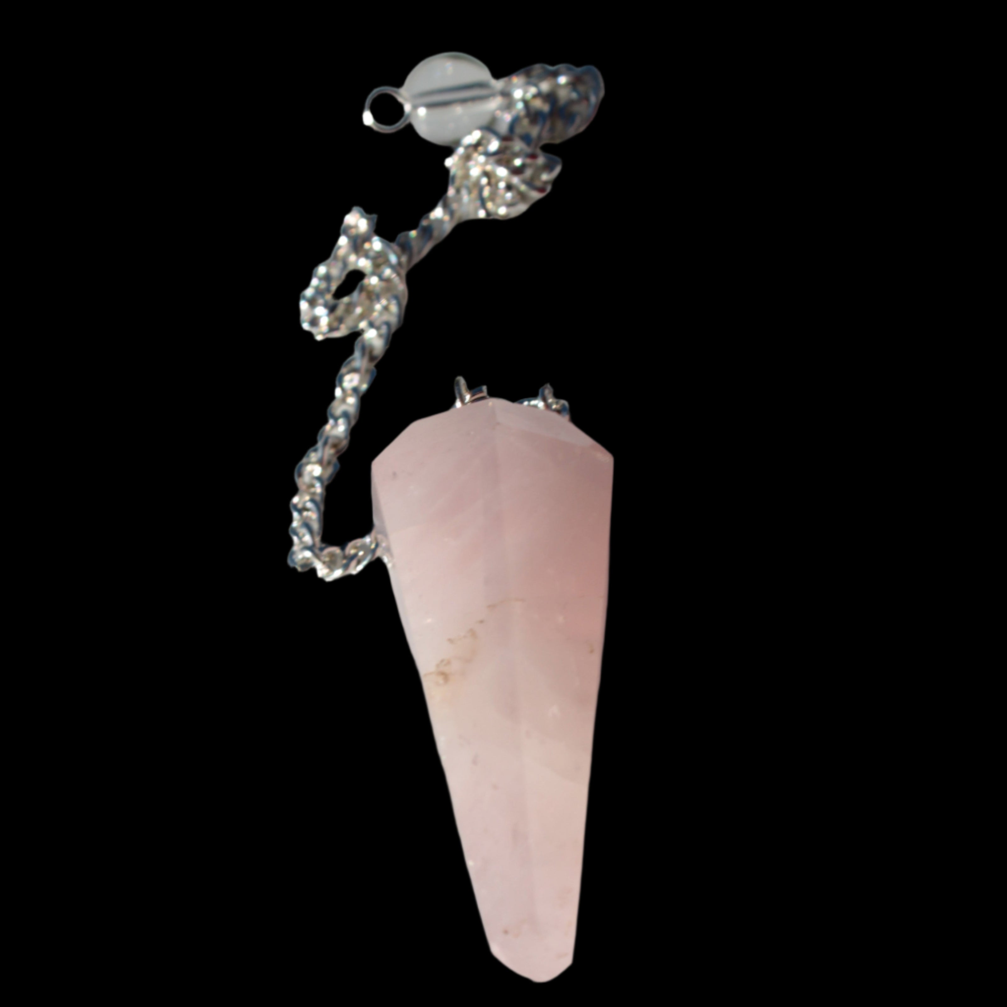 Rose Quartz faceted cone dowsing pendulum 34mm 9g in sunlight - Rocks and Things Store
