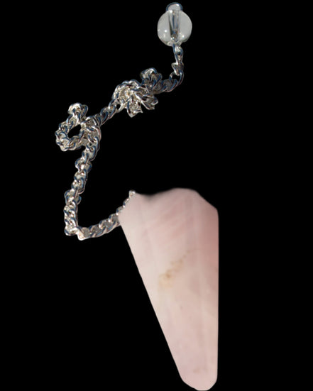 Rose Quartz faceted cone dowsing pendulum 34mm 9g in sunlight - Rocks and Things Store