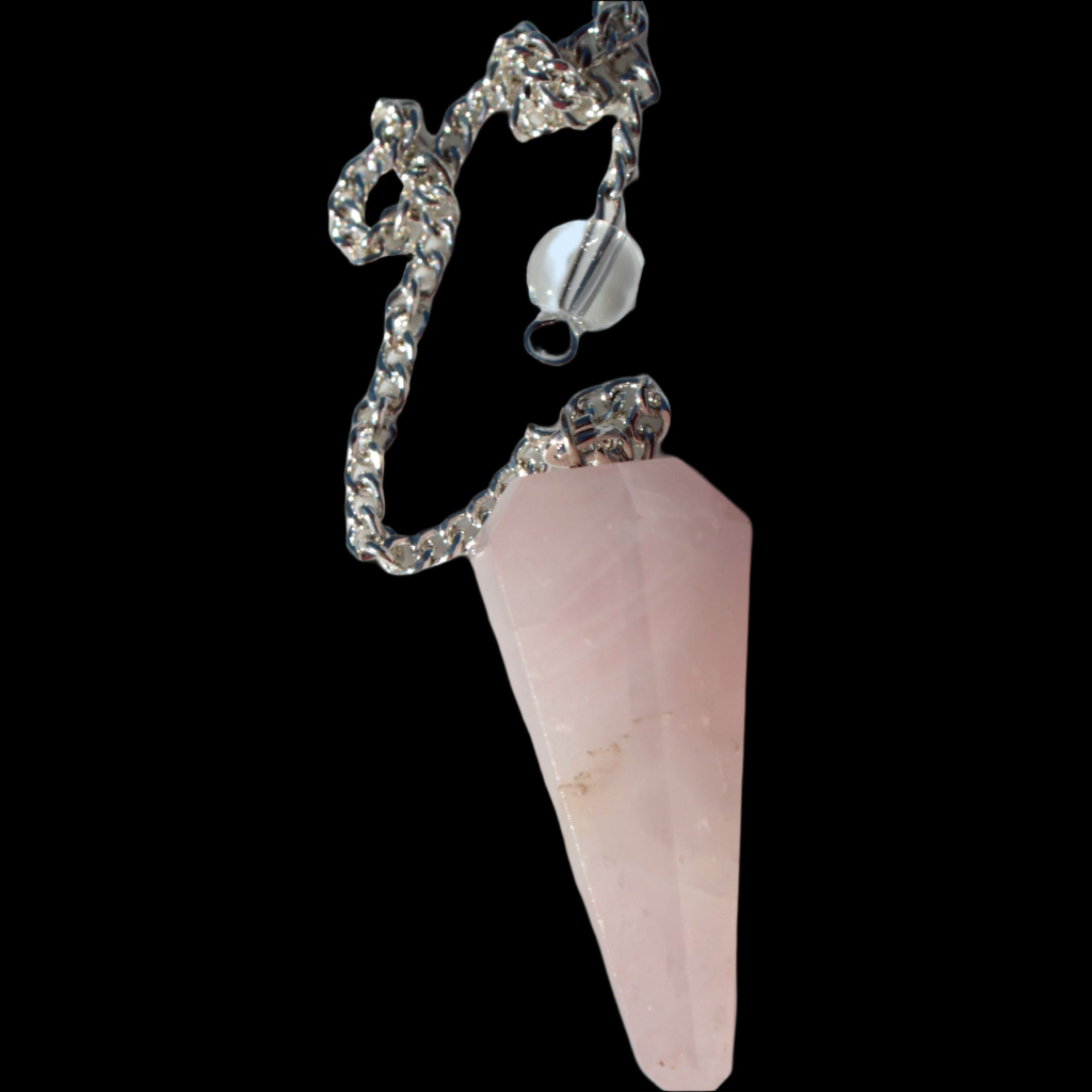 Rose Quartz faceted cone dowsing pendulum 34mm 9g in sunlight - Rocks and Things Store