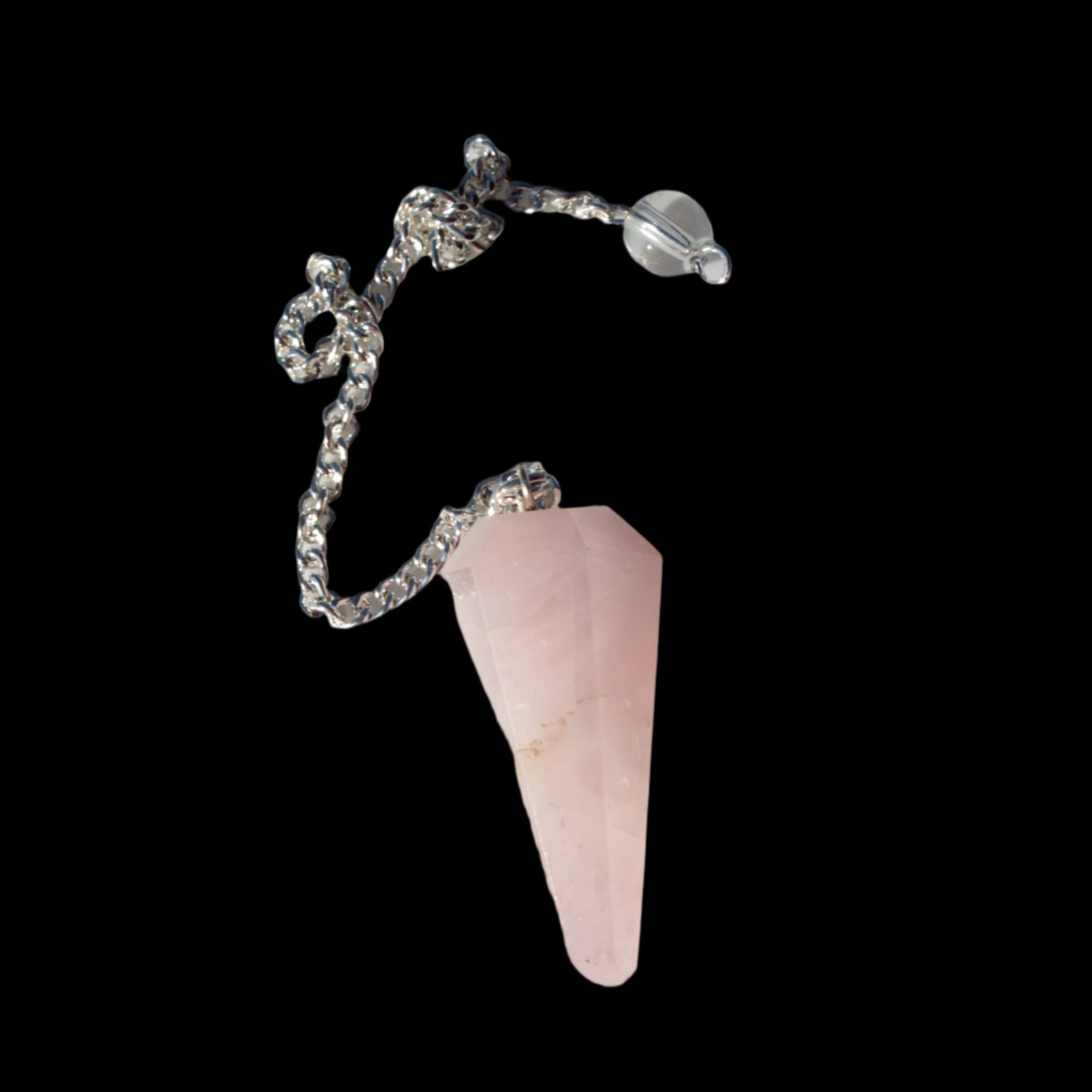 Rose Quartz faceted cone dowsing pendulum 34mm 9g in sunlight - Rocks and Things Store