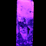 Purple Fantasy Fluorite obelisk 369g in UV light
