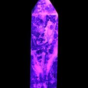 Purple Fantasy Fluorite obelisk 369g in UV light