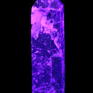 Purple Fantasy Fluorite obelisk 369g in UV light
