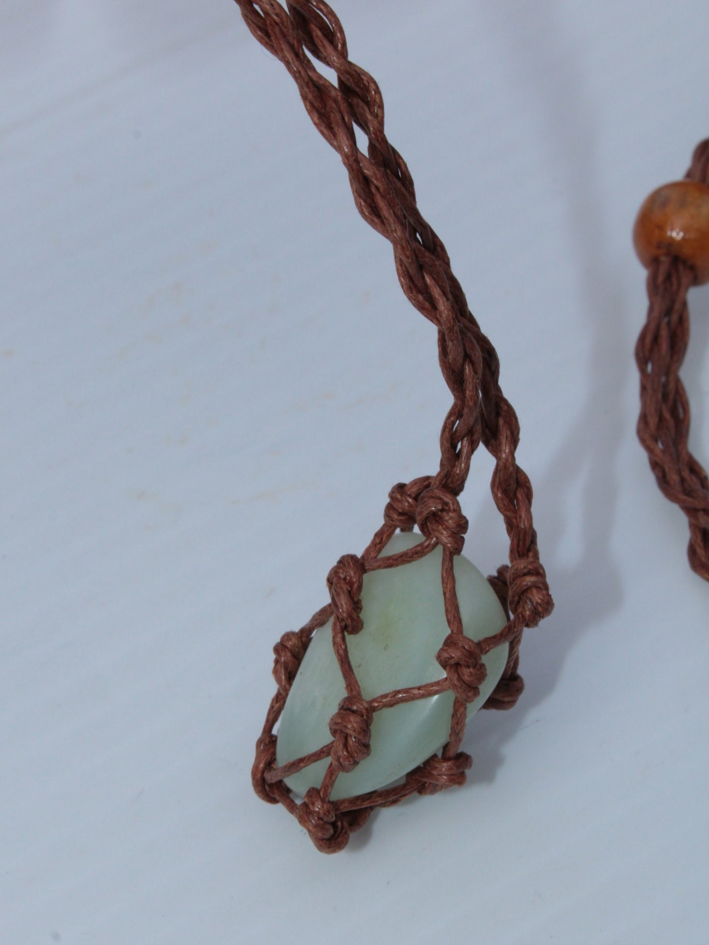 Small brown stone-holder rope cage Rocks and Things