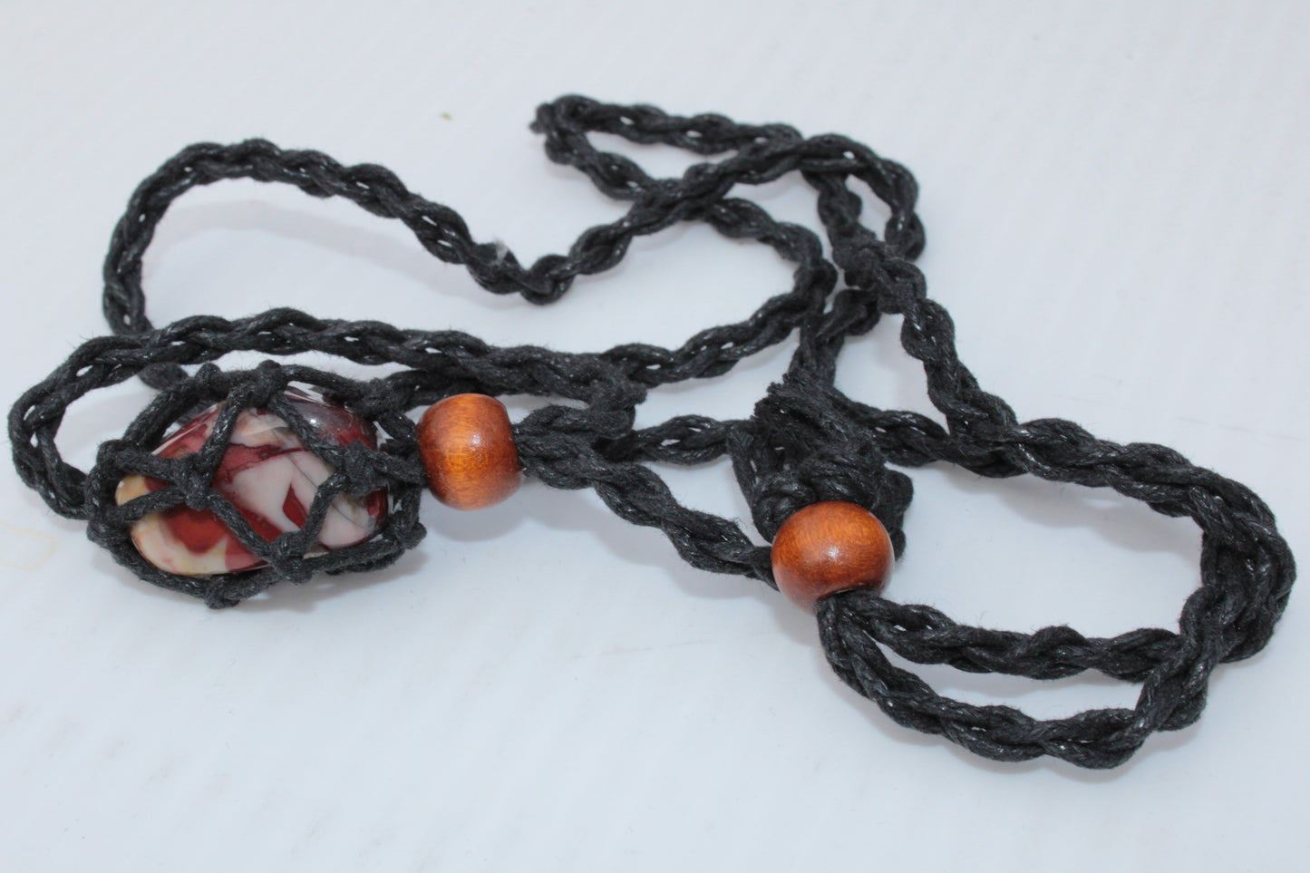 Small black pendant stone-holder rope cage Rocks and Things