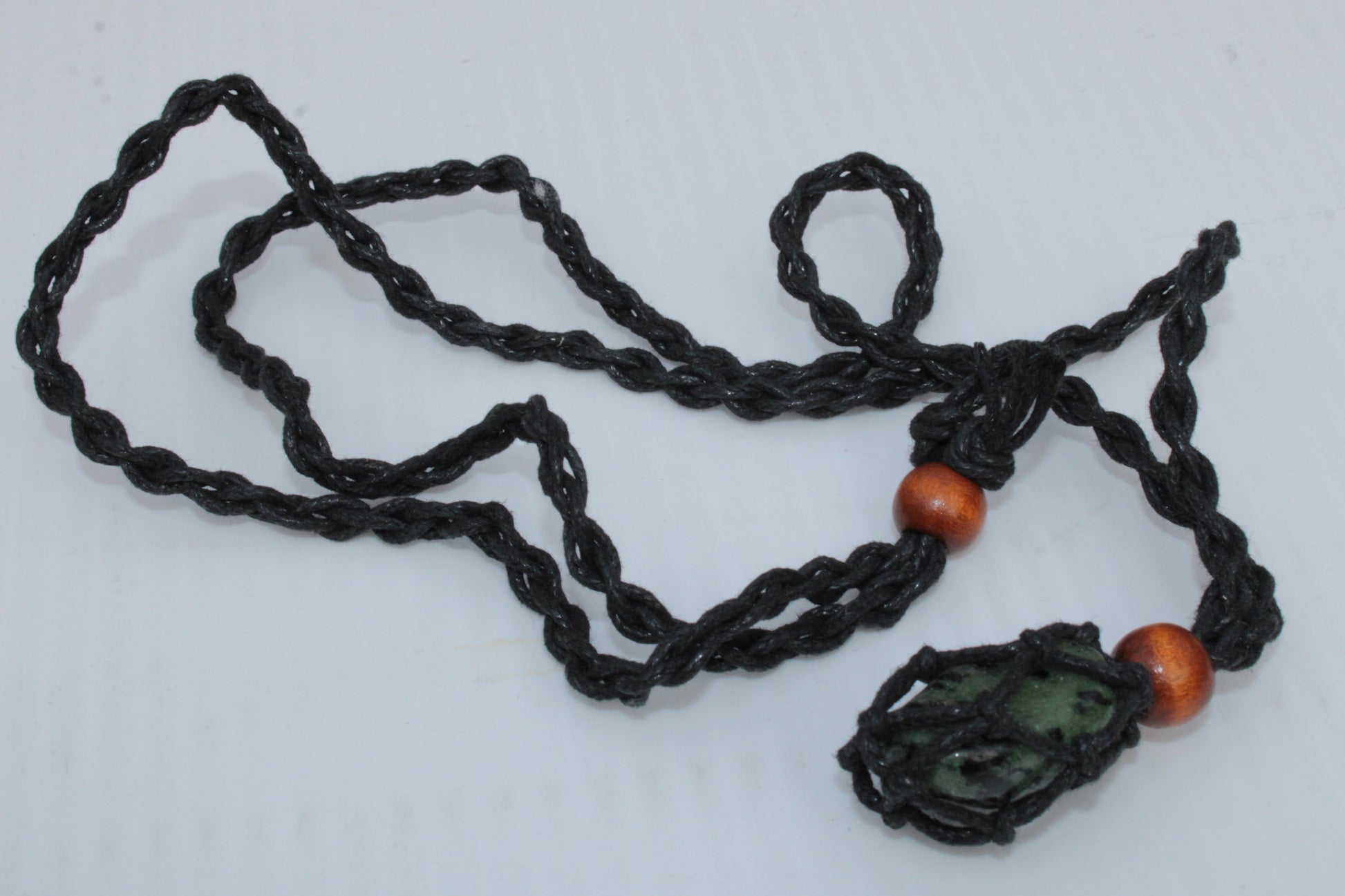 Small black pendant stone-holder rope cage Rocks and Things