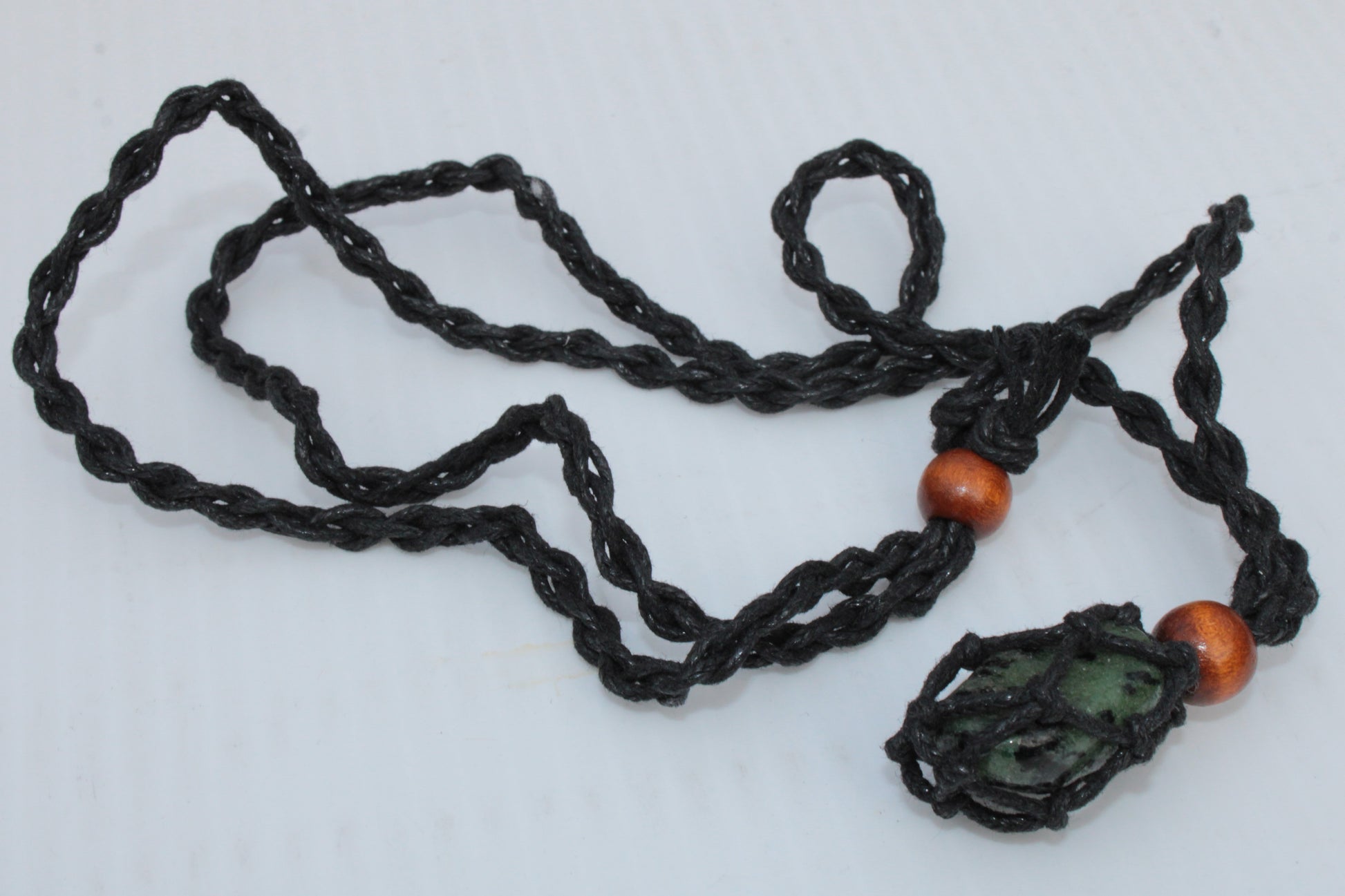 Small black pendant stone-holder rope cage Rocks and Things