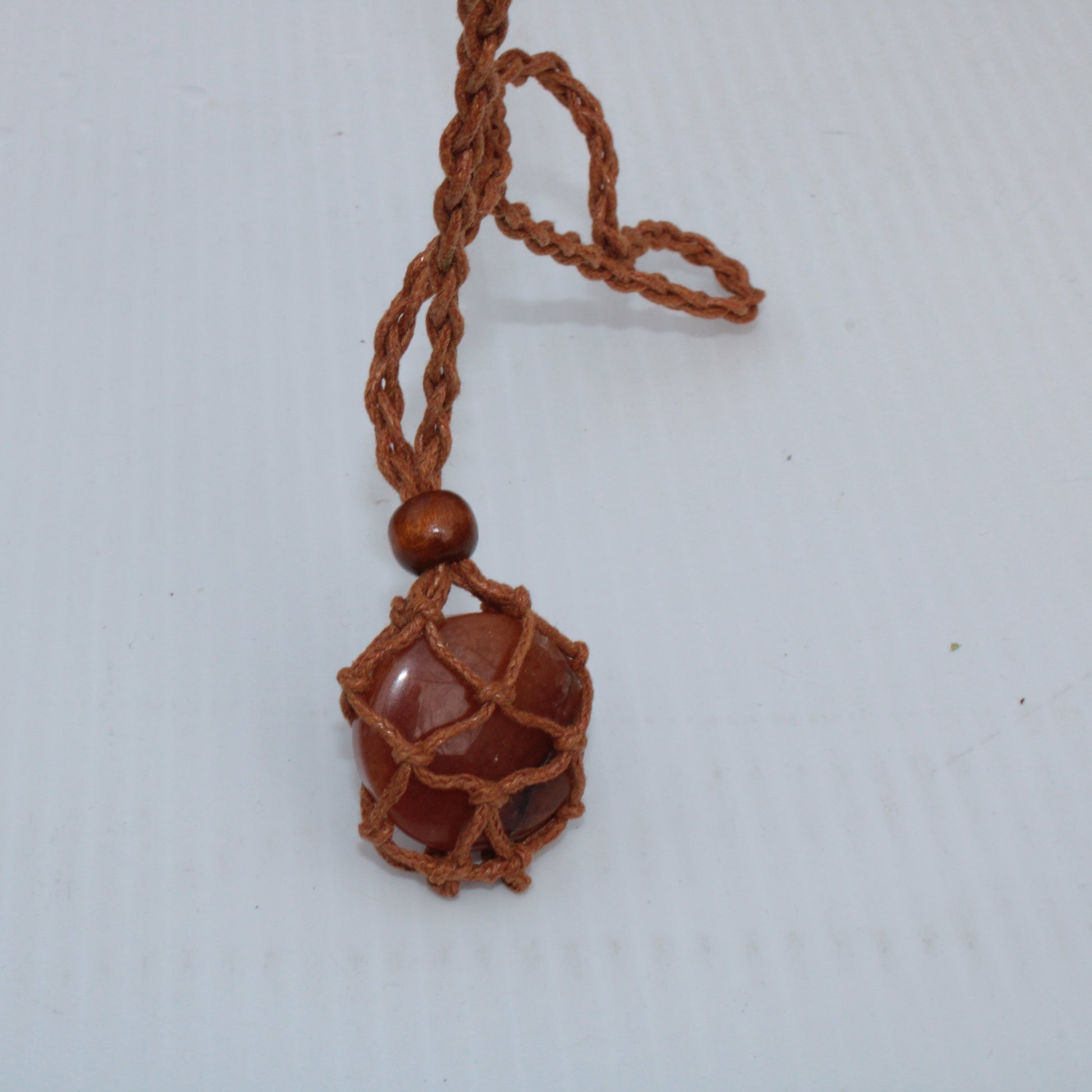 Large brown stone-holder rope cage Rocks and Things