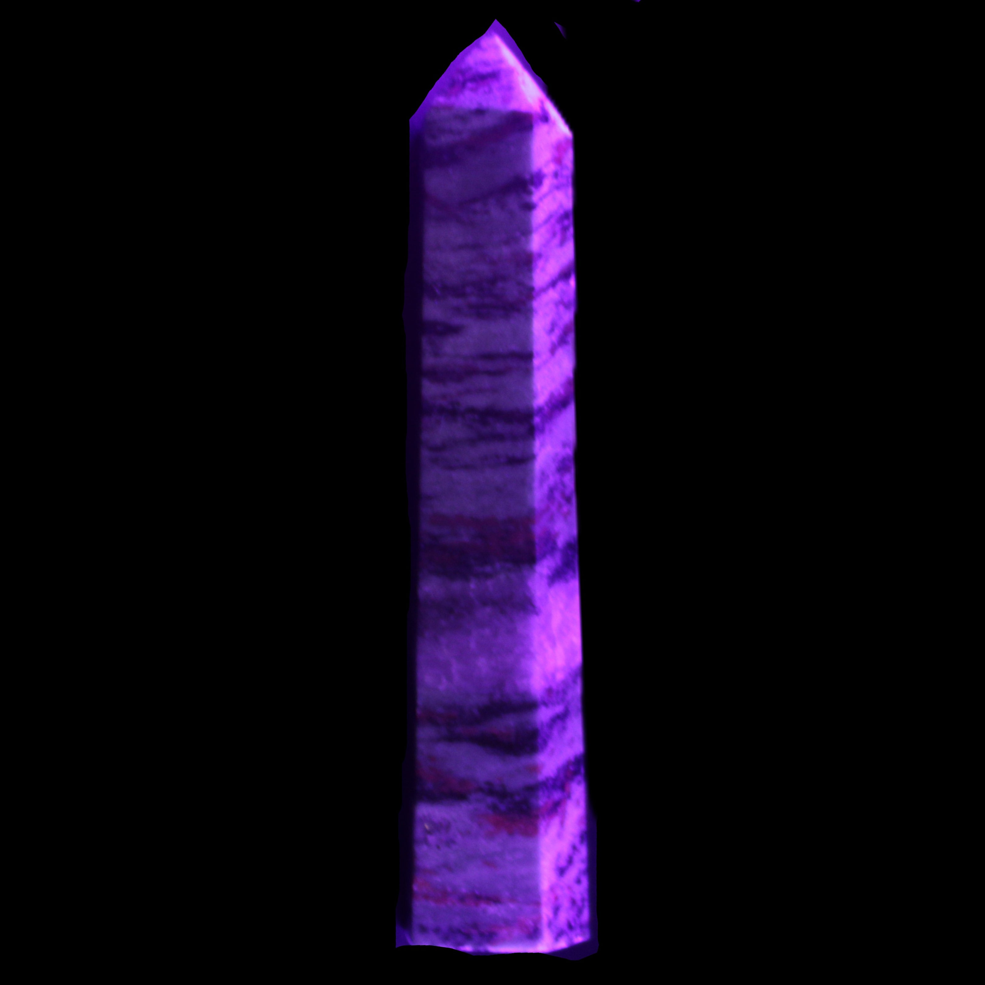 Ruby Zoisite obelisk 574g in UV light - Rocks and Things Store