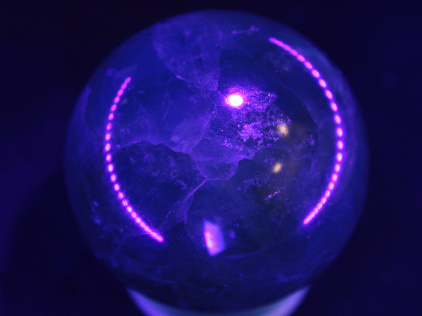 Green Fluorite sphere 427g in UV light