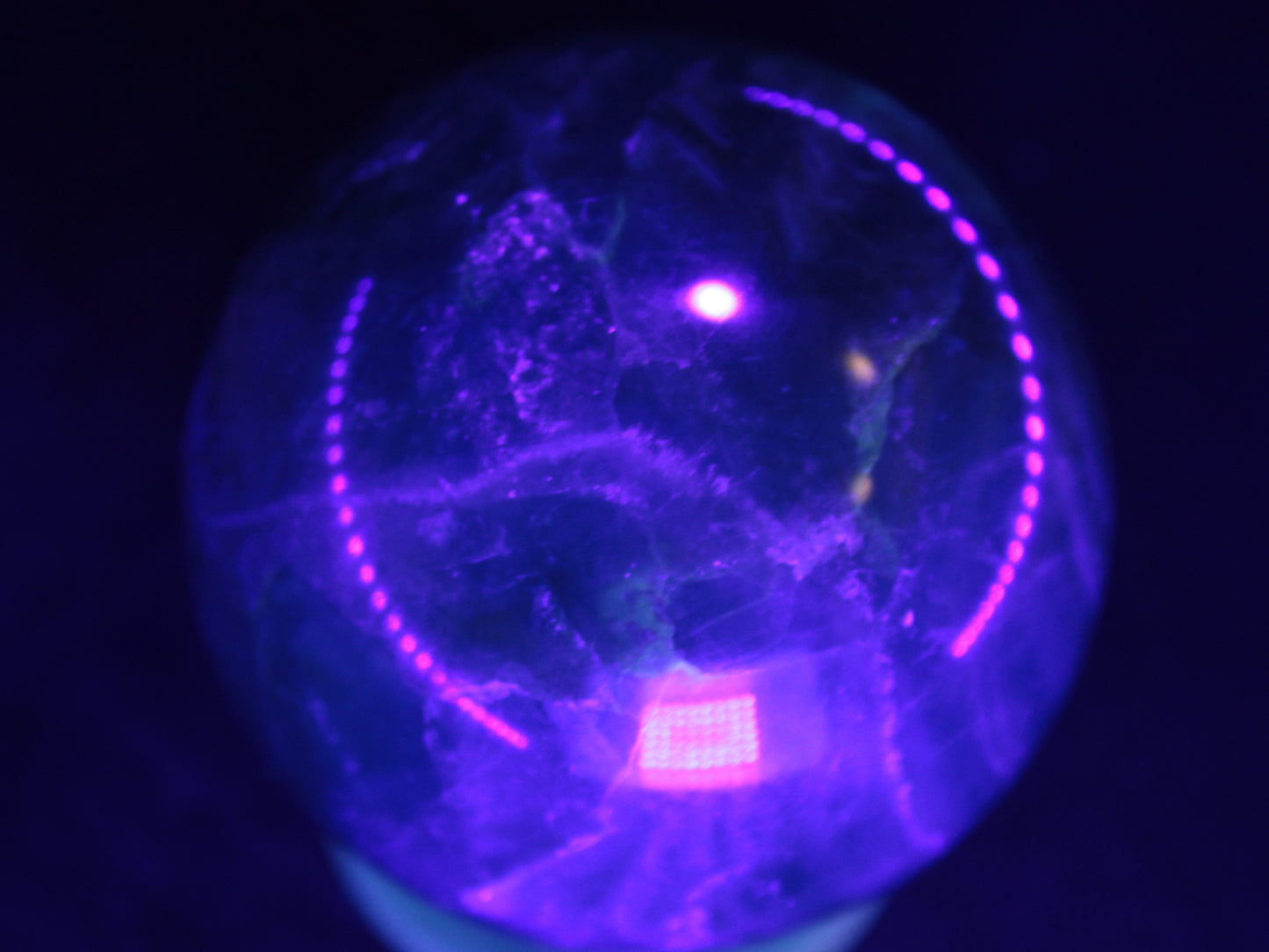 Green Fluorite sphere 427g in UV light