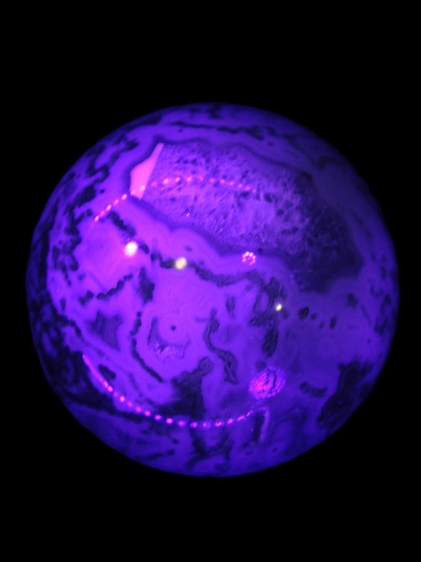 Moss Agate sphere 335g in UV light