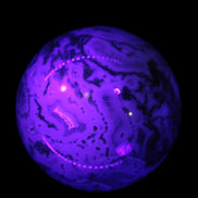 Moss Agate sphere 335g in UV light