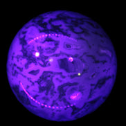 Moss Agate sphere 335g in UV light