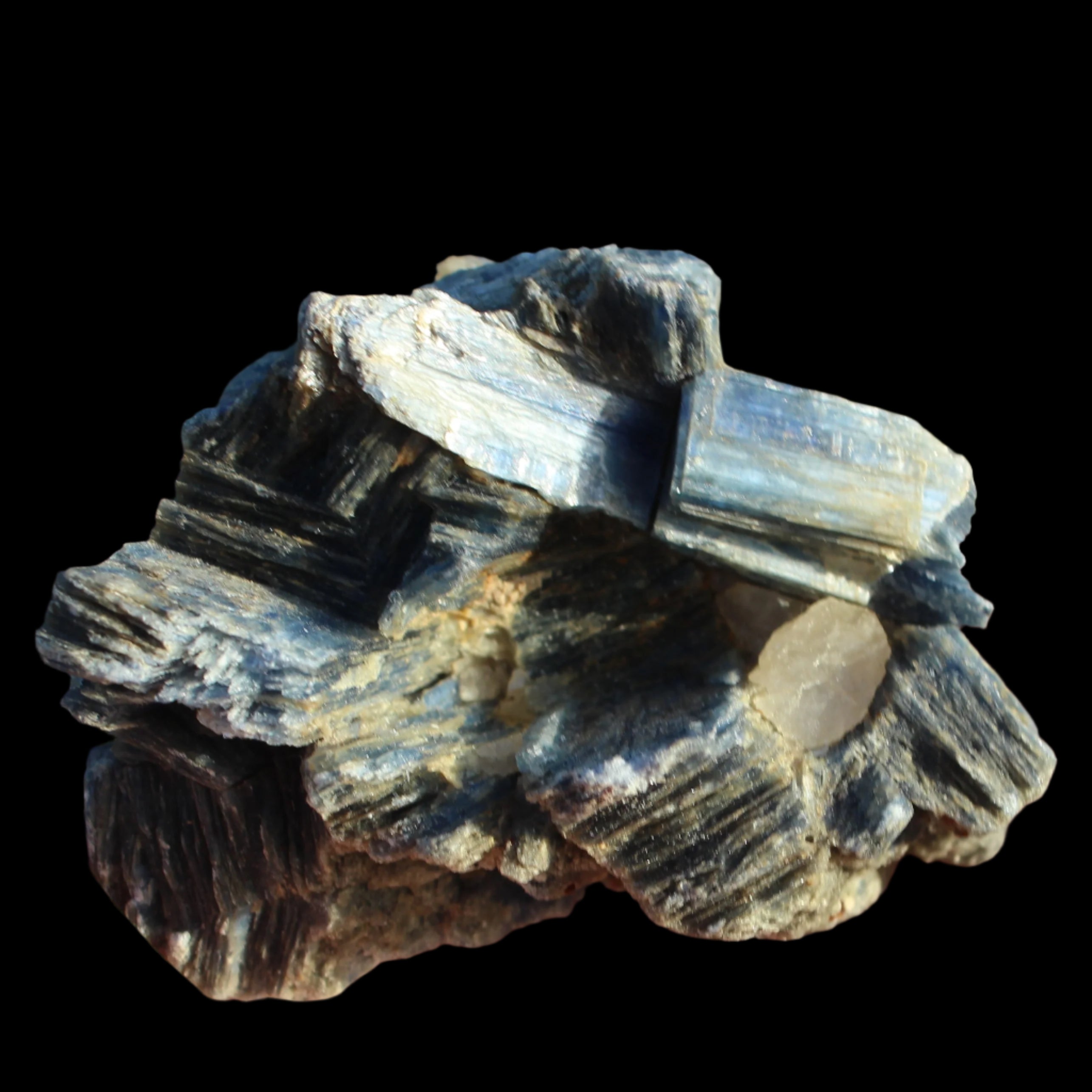 Kyanite cluster with stand 573g in su nlight - Rocks and Things Store