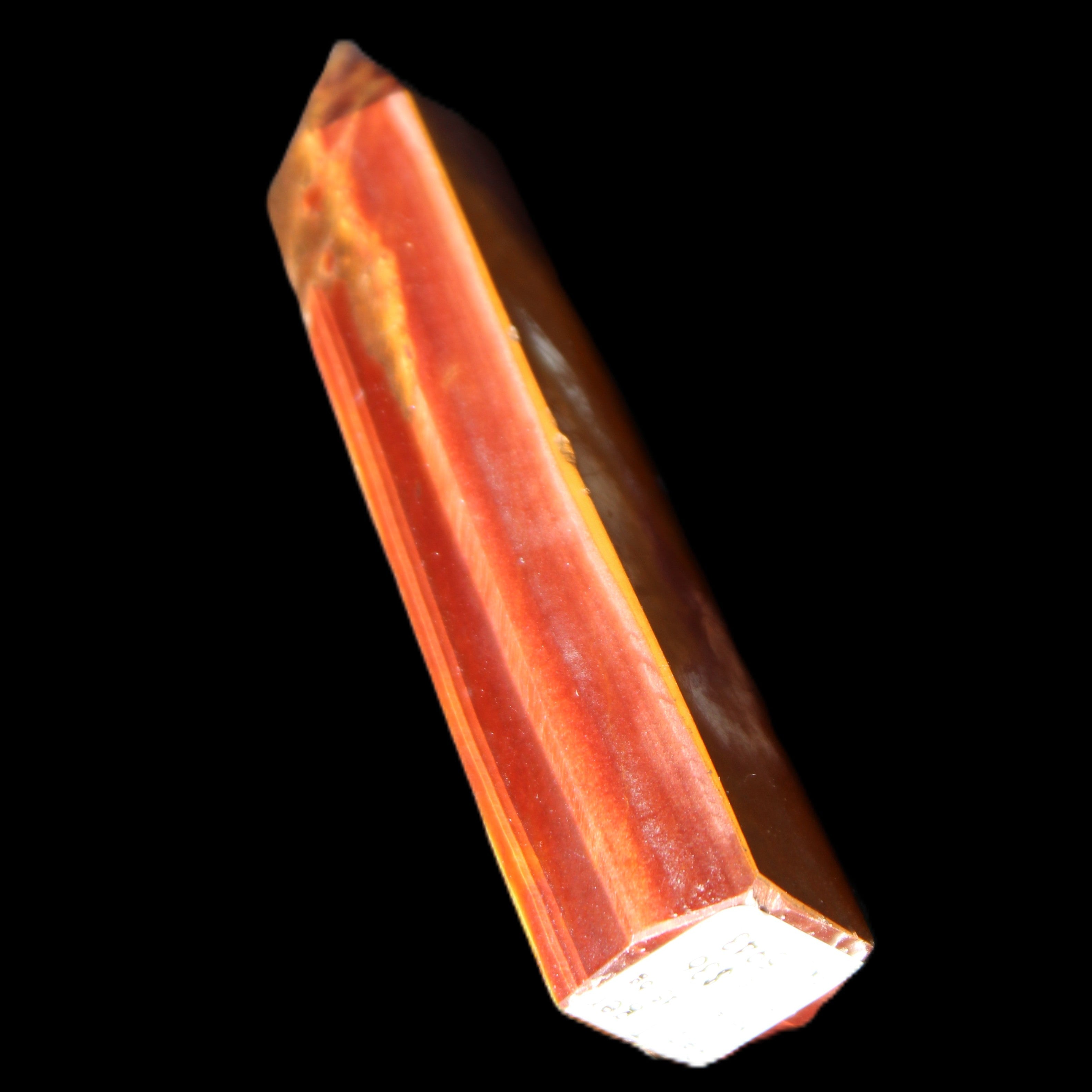 Red Tigers Eye wand 57mm 45.6g in sunlight - Rocks and Things Store