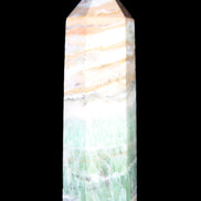 Caribbean Calcite Pellucid wand 83mm 83g in sunlight - Rocks and Things Store