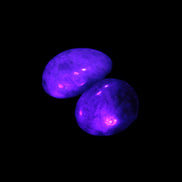 Neon Blue Apatite 2 tumbled stones 17-20mm 14g in UV light - Rocks and Things Store