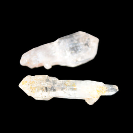 Two sceptre crystals with bridges, enhydro & hydrocarbons 5.3g in bright sunlight