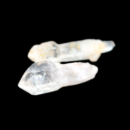 Two sceptre crystals with bridges, enhydro & hydrocarbons 5.3g in bright sunlight