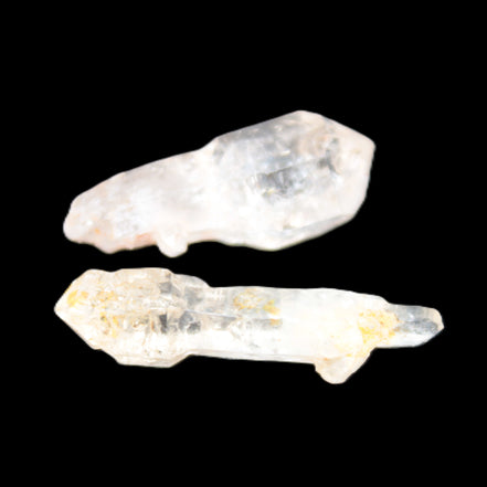 Two sceptre crystals with bridges, enhydro & hydrocarbons 5.3g in bright sunlight