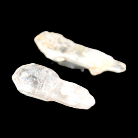 Two sceptre crystals with bridges, enhydro & hydrocarbons 5.3g in bright sunlight