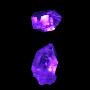 Fenster Quartz Two stubby double terminated crystals 4.4g in UV light