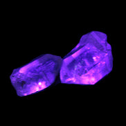 Fenster Quartz Two stubby double terminated crystals 4.4g in UV light