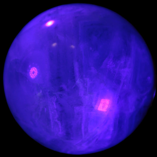 Rainbow Fluorite sphere 58mm 405g in UV light - Rocks and Things Store