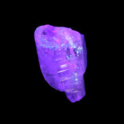 Fenster Crystal with hydrocarbons 34mm 11.6g in UV light