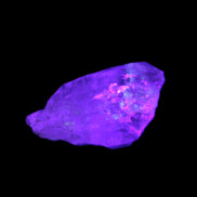 Fenster Crystal with hydrocarbons 34mm 11.6g in UV light