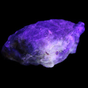 Golden Arusha Quartz 1/2 raw crystals 17-23g in UV light - Rocks and Things Store