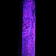 Plum Blossom Jade Rhodonite wand 93g in UV light
