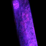 Plum Blossom Jade Rhodonite wand 93g in UV light -  Rocks and Things Store
