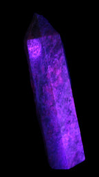 Plum Blossom Jade Rhodonite wand 93g in UV light -  Rocks and Things Store