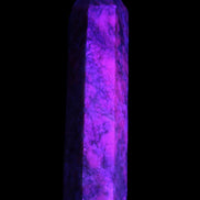 Plum Blossom Jade Rhodonite wand 93g in UV light -  Rocks and Things Store