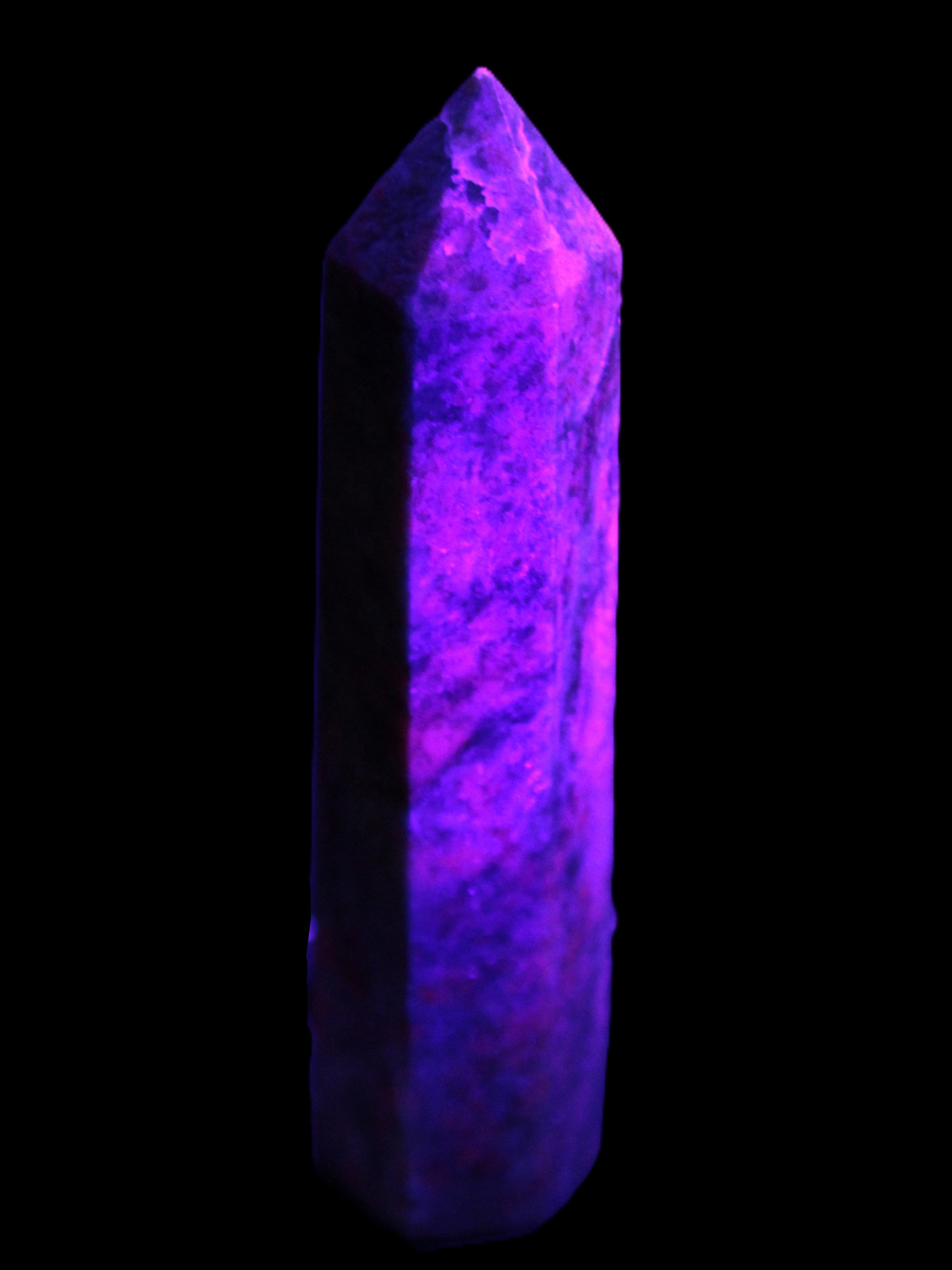 Plum Blossom Jade Rhodonite wand 93g in UV light -  Rocks and Things Store