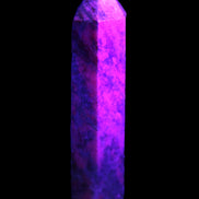 Plum Blossom Jade Rhodonite wand 93g in UV light -  Rocks and Things Store