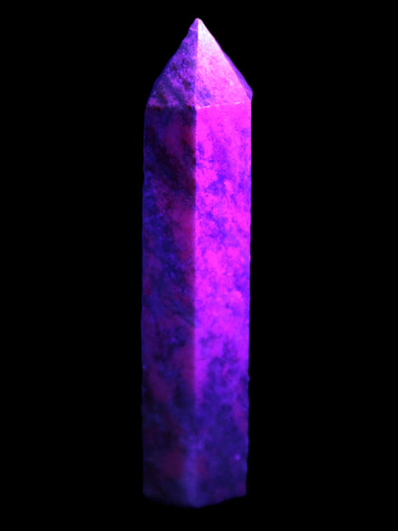 Plum Blossom Jade Rhodonite wand 93g in UV light -  Rocks and Things Store