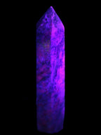 Plum Blossom Jade Rhodonite wand 93g in UV light -  Rocks and Things Store
