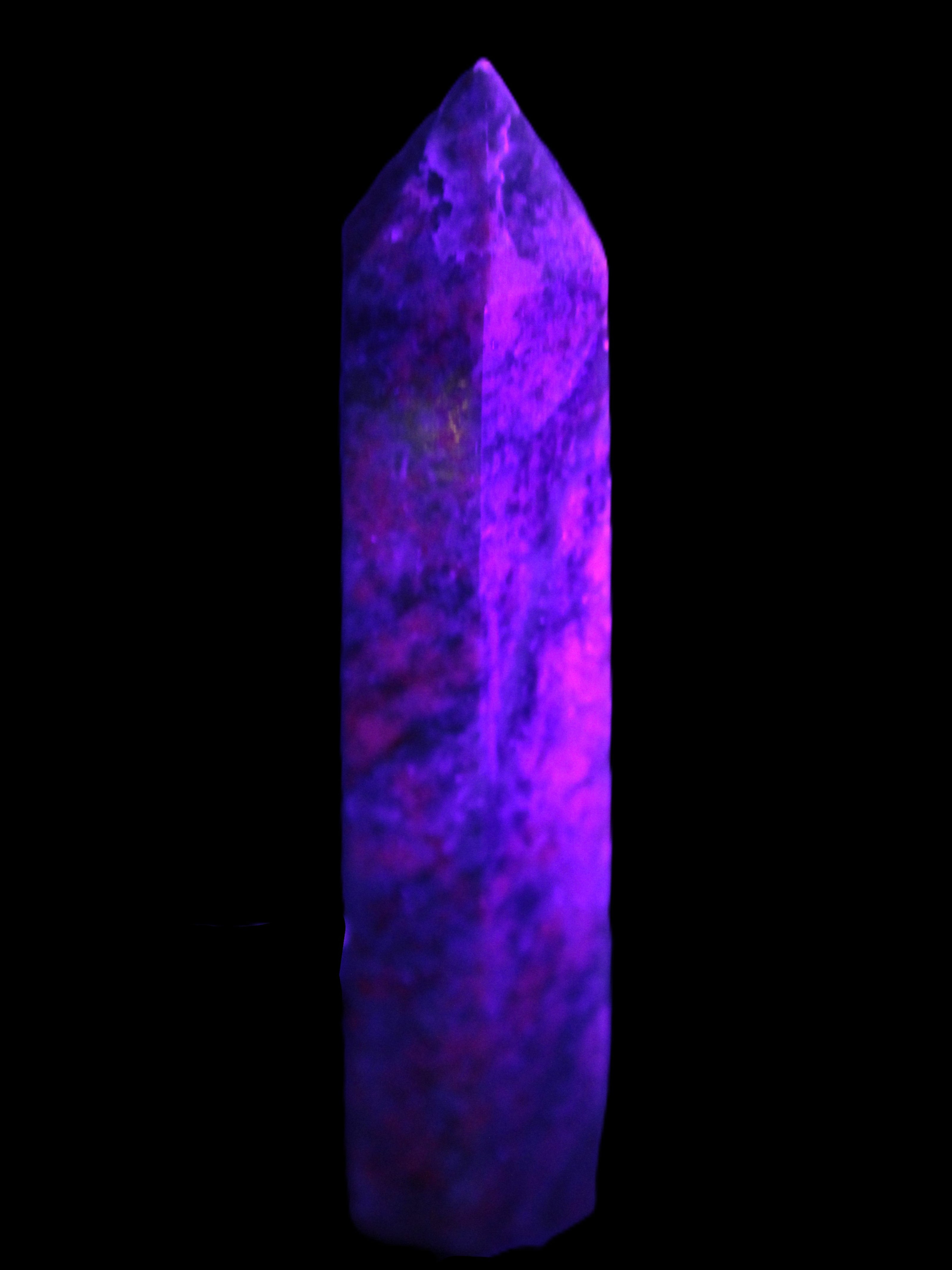 Plum Blossom Jade Rhodonite wand 93g in UV light -  Rocks and Things Store