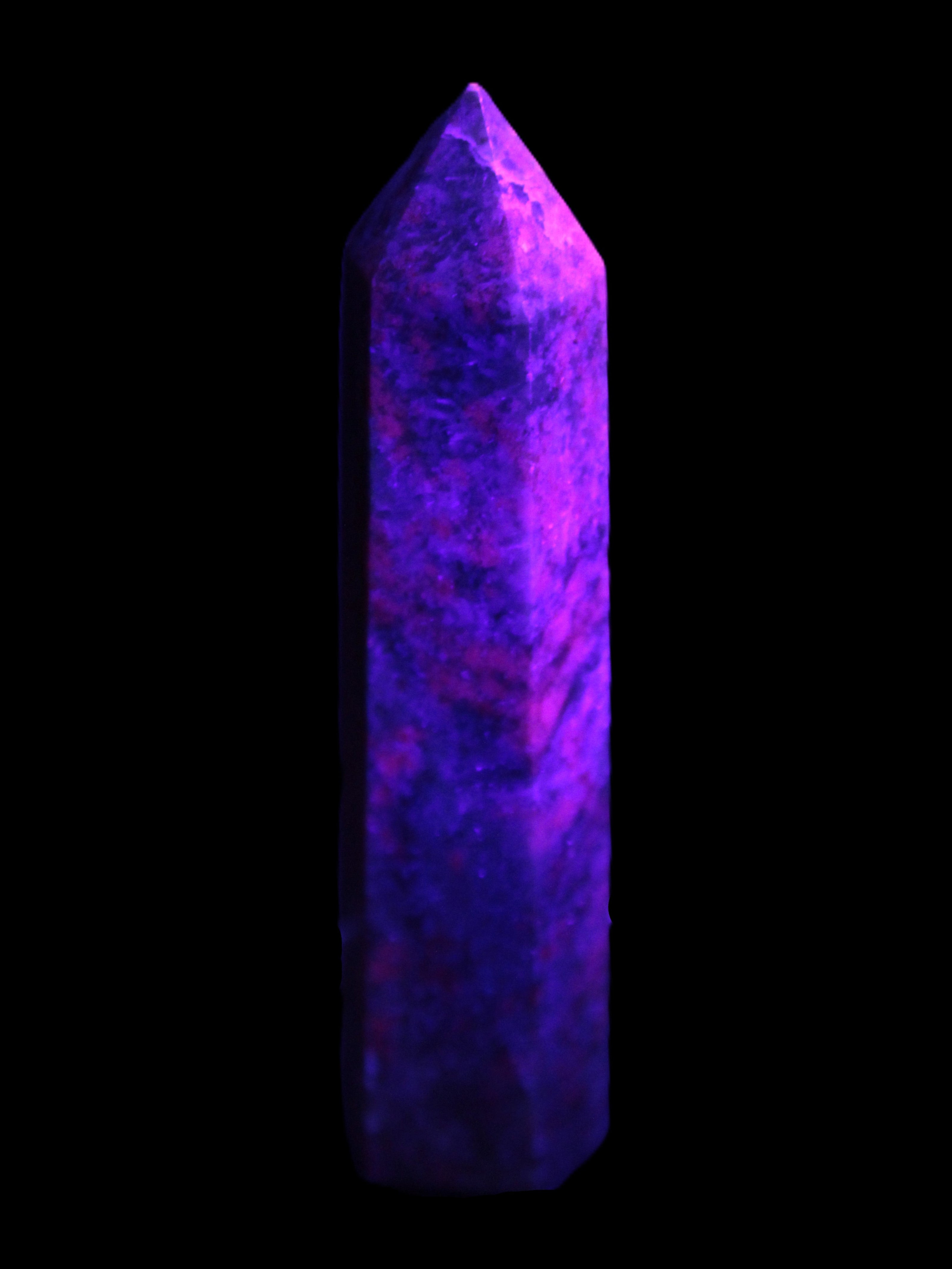Plum Blossom Jade Rhodonite wand 93g in UV light -  Rocks and Things Store
