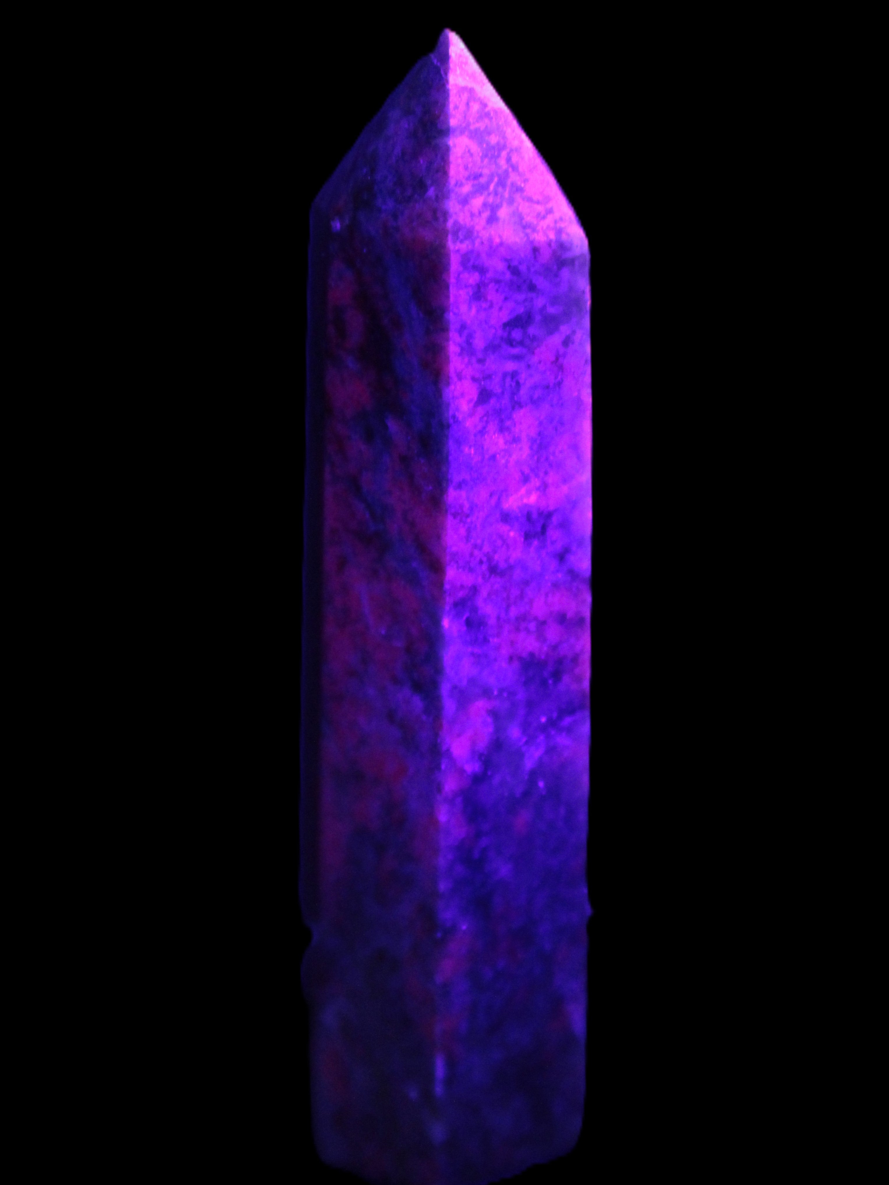 Plum Blossom Jade Rhodonite wand 93g in UV light -  Rocks and Things Store
