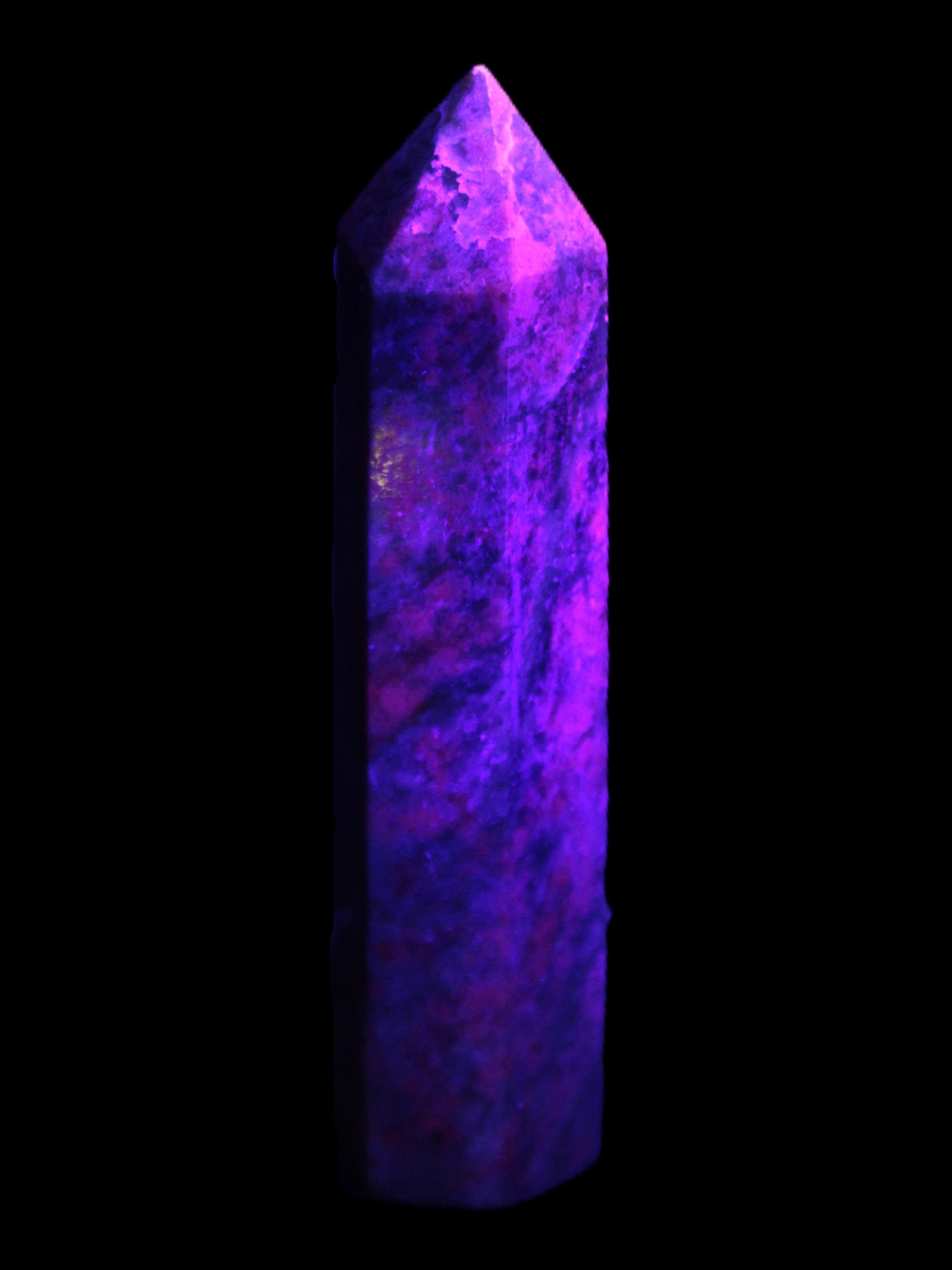Plum Blossom Jade Rhodonite wand 93g in UV light -  Rocks and Things Store