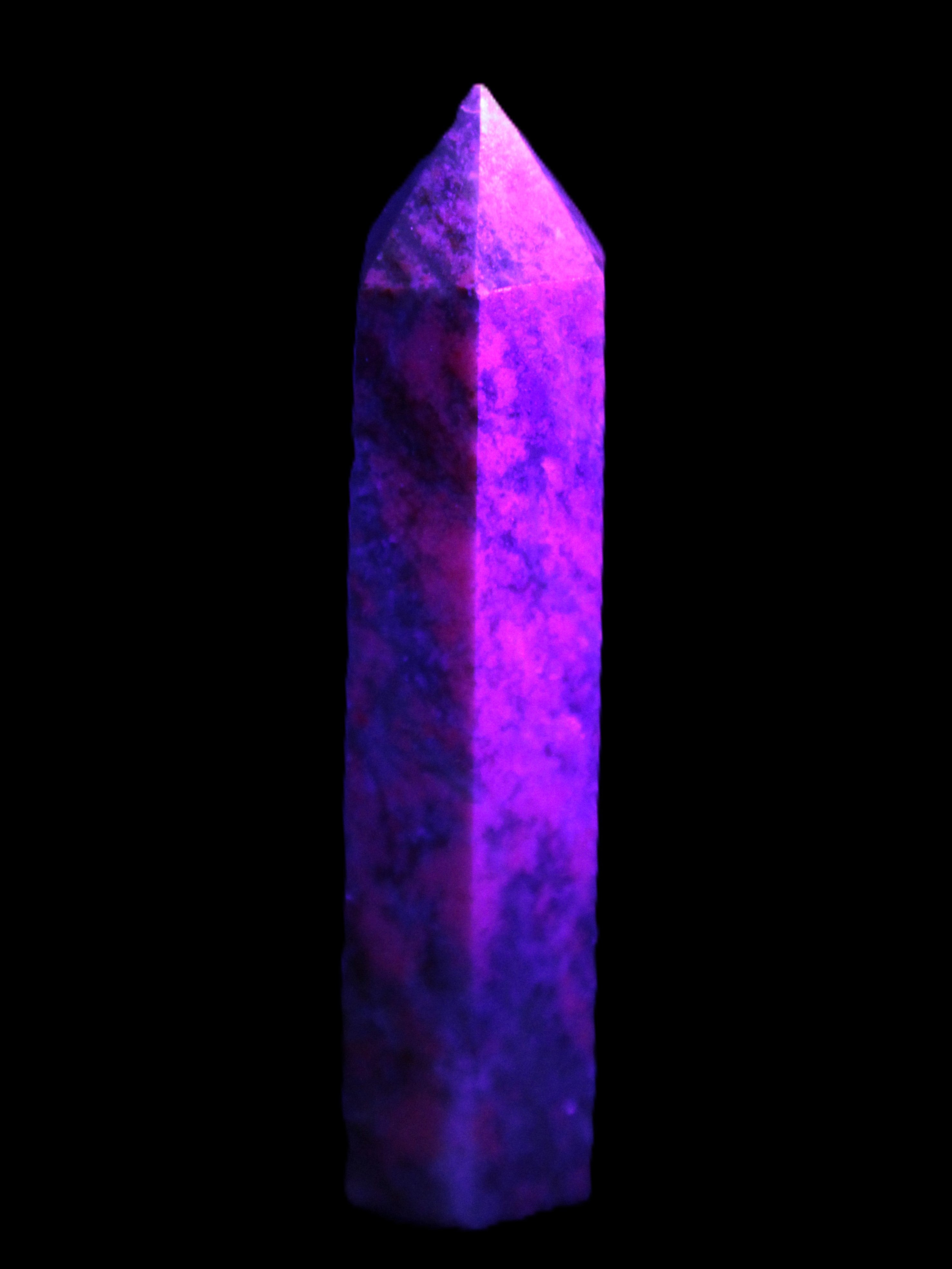 Plum Blossom Jade Rhodonite wand 93g in UV light -  Rocks and Things Store